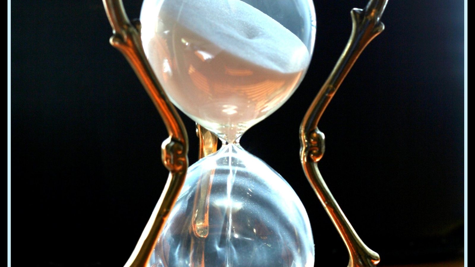 An hourglass with sand running through it