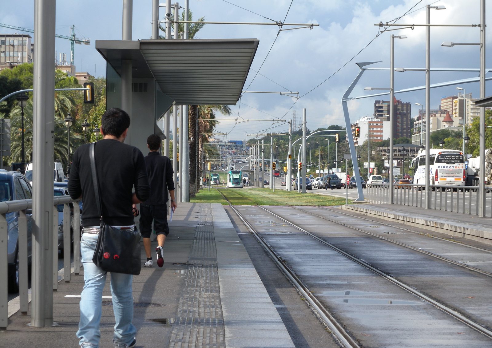 Tram stop in Barcelona with people waiting