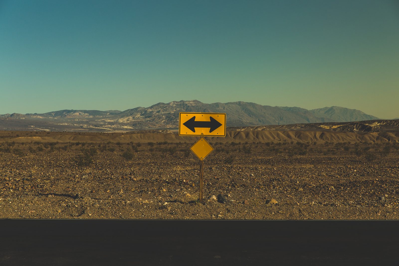 A road sign pointing in two opposite directions