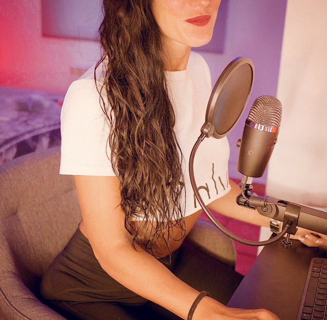 Graciela recording Spanish lessons with a professional microphone